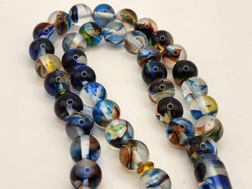 سبحه بكالايت 10 ملي 45 خرزه باللون الشفاف المموج