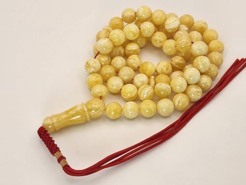 سبحه كهرمان كلنقرادي مشخط بياض كامل 42 جرام