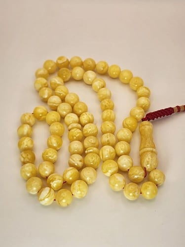 سبحه كهرمان كلنقرادي مشخط بياض كامل 42 جرام