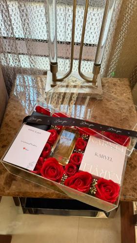 A love gift: a watch, perfume, and pen