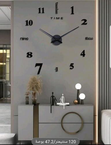 Three-dimensional black wall clock + black three-d...
