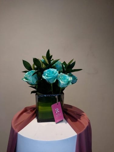 Blue Floral Vase Arrangement/تنسيق زهور زرقاء في م...