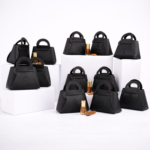 توزيعات مخلط دهن عود مع كسره عود ميني شنطة