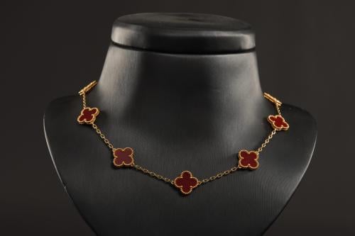 Person's necklace, red color