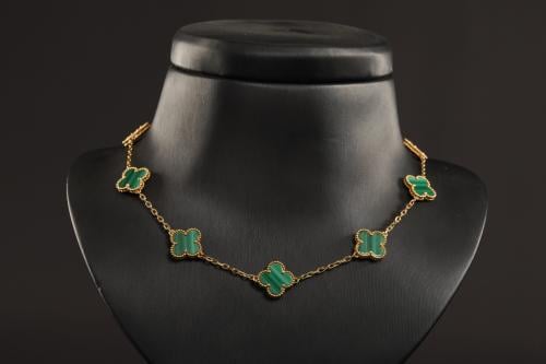Person's necklace, green color