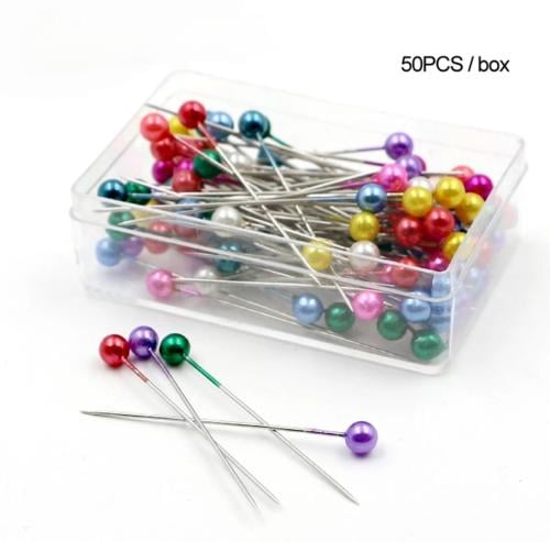 علبة من دبابيس اللولو الملونه