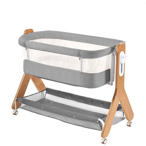 سرير مواليد بجوار الام