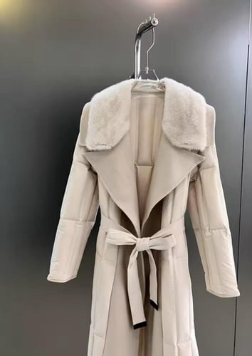 cream coat featuring a genuine mink fur collar and...