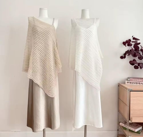 Beige - A two-piece set featuring a one-shoulder s...