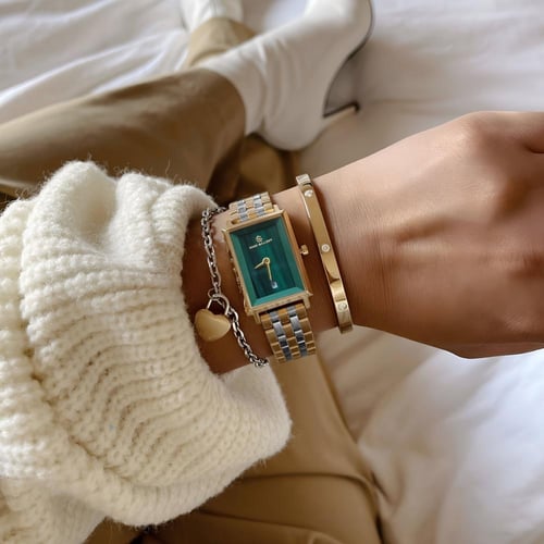 ساعة ديزاير النسائية سادة استيل ذهبي فضي