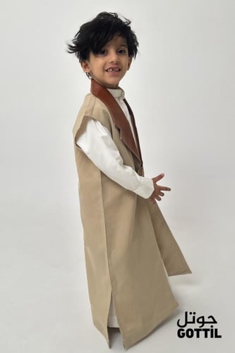 دقله اطفال لون بيج مطعم بجلد جملي