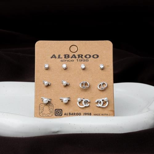 مجموعة أقراط فضي بتصاميم متنوعة تجمع بين الأناقة و...