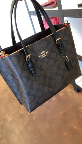 حقيبة كوتش بني غامق