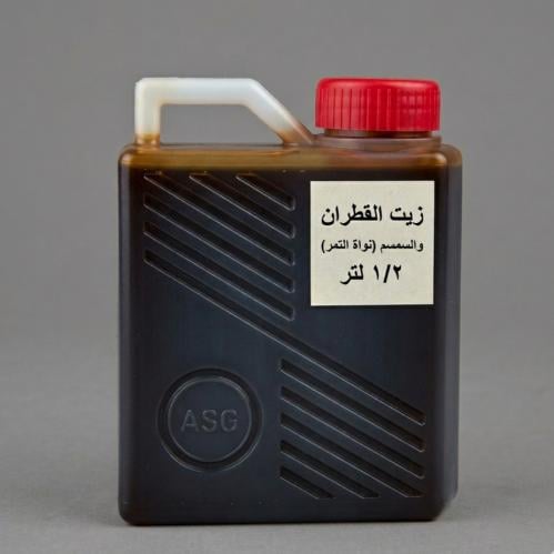 زيت القطران مع السمسم مع مسحوق ونواة التمر 500 مل