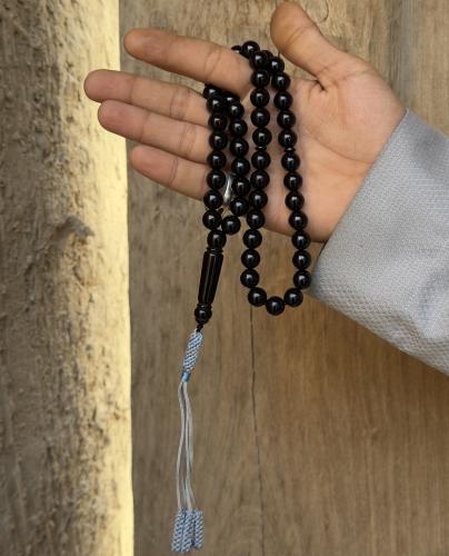 Handmade black agate prayer beads with a Karkoush strap