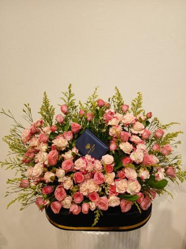 Wooden stand covered with black velvet and natural...