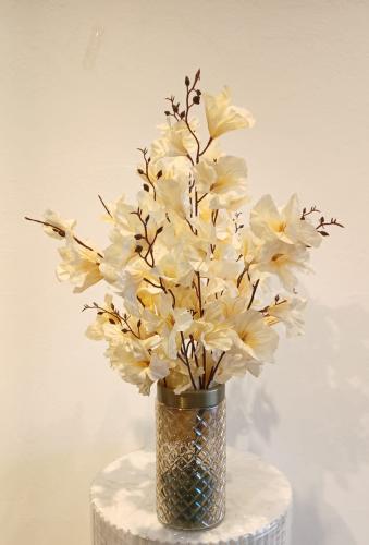 A transparent vase inclined to the honey color wit...