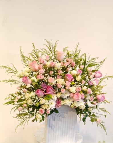 Wooden stand with natural flowers
