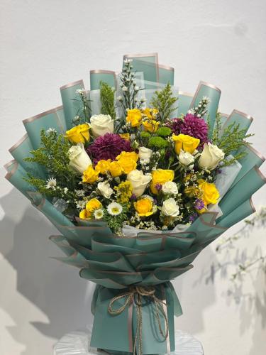 A bouquet of natural baby rose with chamomile