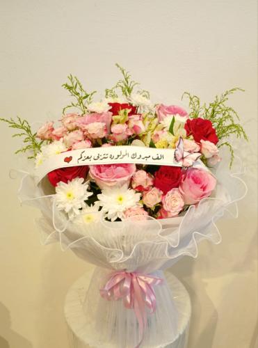 A bouquet of natural flowers, chiffon wrapping