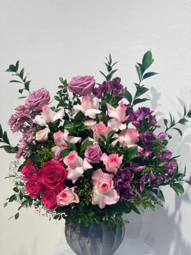 Clay vase with natural rose spray with natural amb...