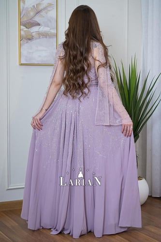 فستان سهره موف ناعم راقي باكمام فراشه وتطريز من ال...