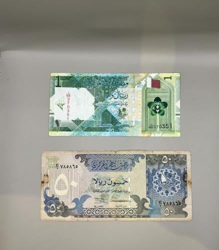 2 قطع عملة قطرية متنوعة