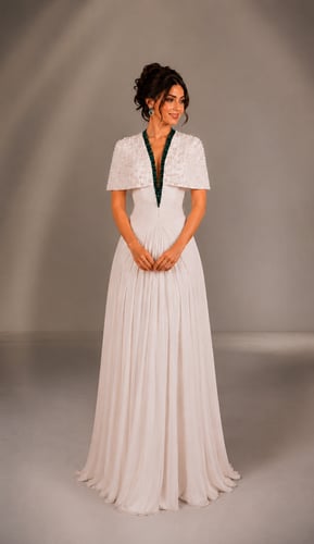 Luxurious evening dress in ivory with pearl embroi...
