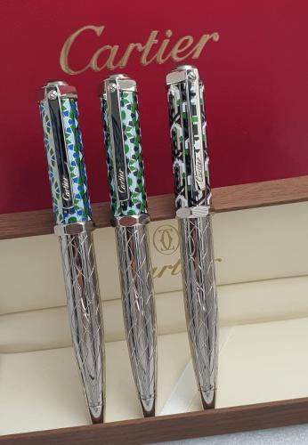 Three luxury ballpoint pens from the Cartier brand