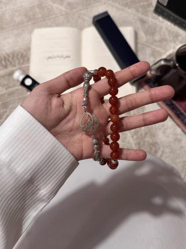 A beaded rosary with the name