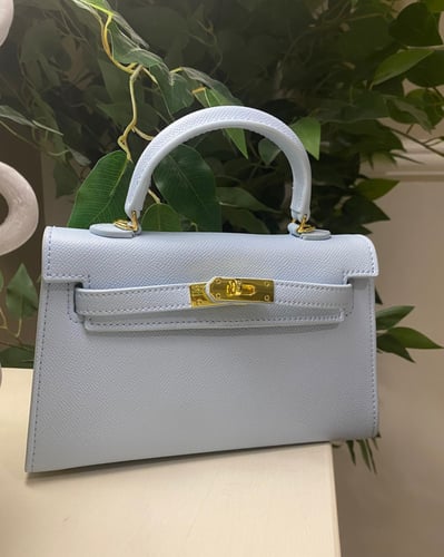 سمول هاندباق | pastel blue hardware gold