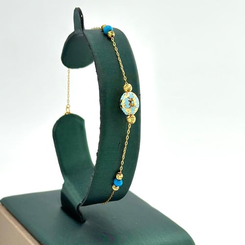 طقم ذهب مع كور الليزر بالون الميناء ( 9.8 جرام - ع...