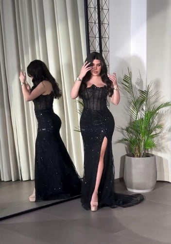 فستان اسود ماسك ع جسم