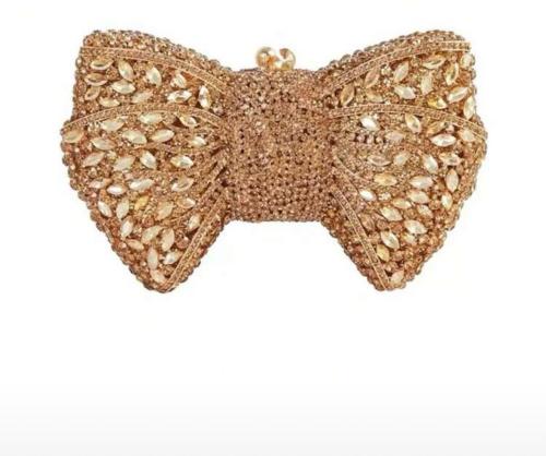A clutch for evening decorated with crystals, butt...