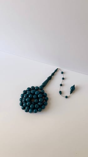 مسباح دائري ازرق بعرق اسود