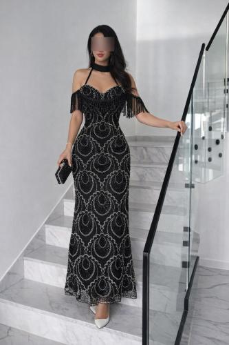 Black evening dress embroidered with beads with a...