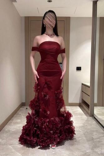 Elegant maroon evening dress with floral details