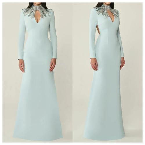 Luxury evening dress made of blue jersey with a high collar and long sleeves