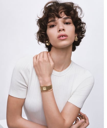 An elegant watch with a gold bracelet made of stainless steel, waterproof, from Calvin Klein