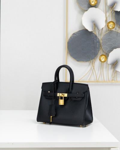 شنطة عملية صغيرة الحجم جلد بلون الاسود