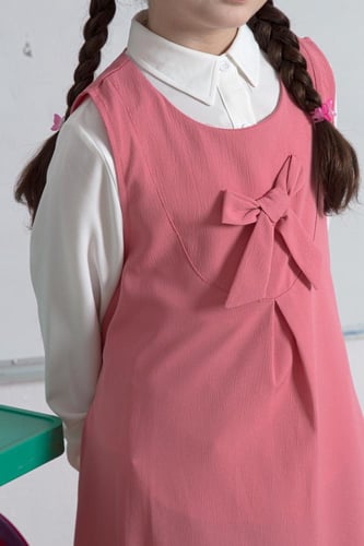 مريول مدرسي زهري بسيط وأنيق مع فيونكة أمامية