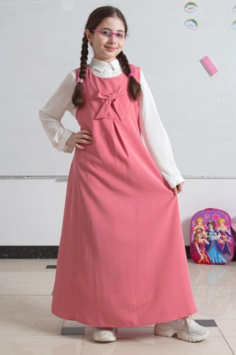 مريول مدرسي زهري بسيط وأنيق مع فيونكة أمامية