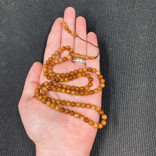 سبحة كوك طبيعي بحبات دائرية صغيرة وشرابة سيستملي