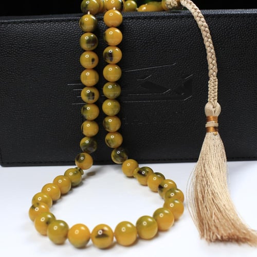 مسباح مسكي أصفر زيتي ببقع خضراء