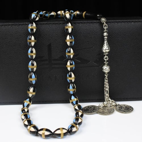 سبحة كوك طبيعي 33 خرزة بيضوية مرصعة بالنحاس