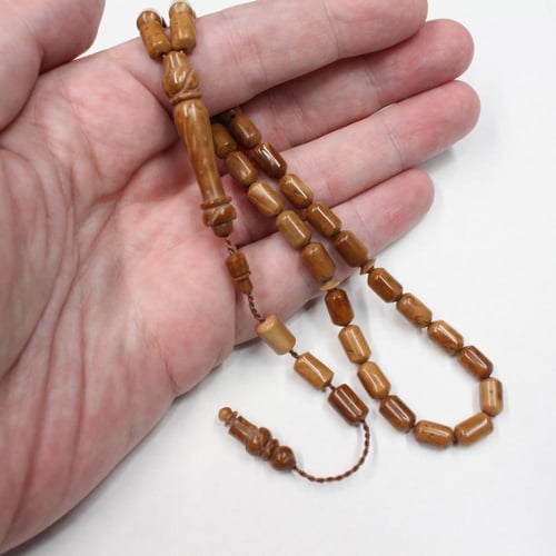 سبحة كوك طبيعي بحبات صغيرة أسطوانية وشرابة سيستملي