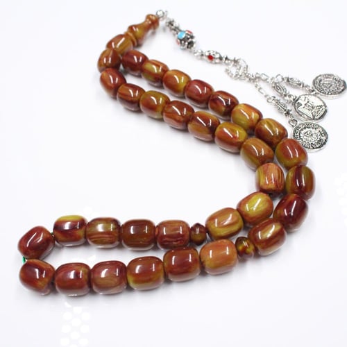 سبحة مسكي زيتي ممزوج بالبني بحبات أسطوانية كبيرة و...