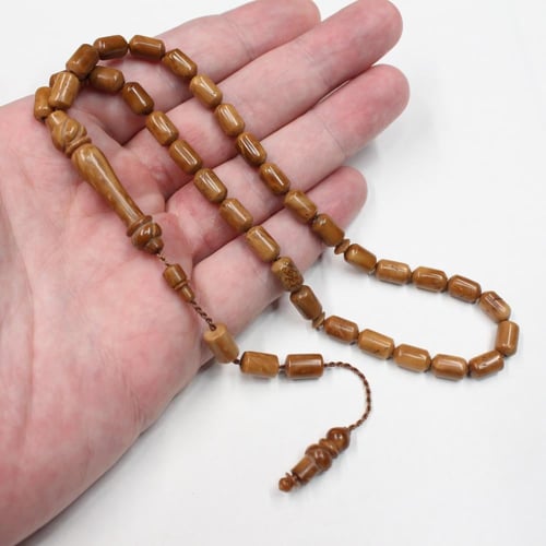 سبحة كوك طبيعي بحبات صغيرة أسطوانية وشرابة سيستملي
