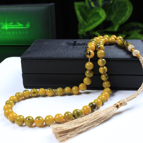 مسباح مسكي أصفر زيتي ببقع خضراء