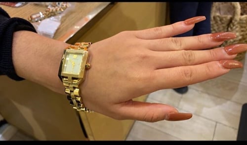 ساعه توري ذهبي